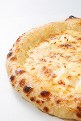 Close up cheese pizza showing baked crust melted mozzarella texture and golden surface