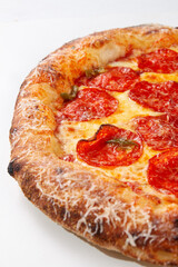 Close up pepperoni pizza showing baked crust spicy salami jalapeno honey and melted cheese