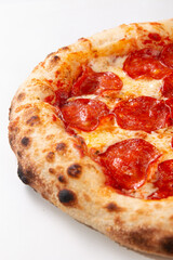 Close up pepperoni pizza showing baked crust spicy salami and melted cheese
