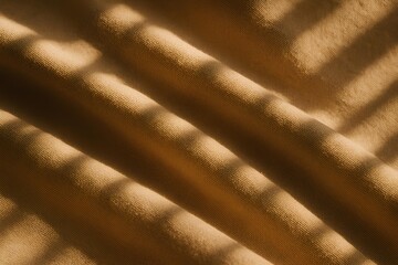 Macro textile surface with strong directional light and warm beige shadows.