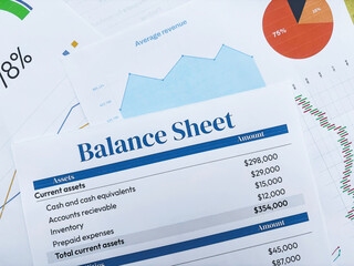 Finance and business concept balance sheet paper top view close up background.