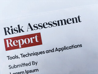 Risk Assessment report title close up background frop top.