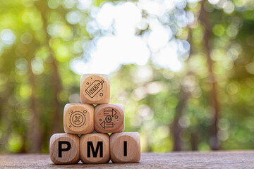 PMI private mortgage insurance symbol. Concept words PMI private mortgage insurance on blocks on a beautiful background from dollar bills. Business PMI private mortgage insurance concept.