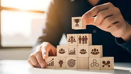 Business person building a pyramid of wooden blocks with success icons, symbolizing strategy, growth, and achieving goals towards ultimate triumph