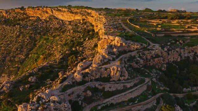 Drone view of famous sunset spot. Countryside, rocks, hills. Dingli cliffs, Mediterranean sea, Malta