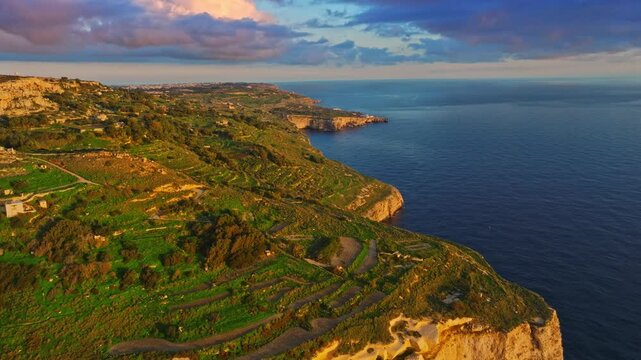 Drone aerial view of famous sunset spot. Countryside, rocks, hills. Dingli cliffs, Mediterranean sea, Malta