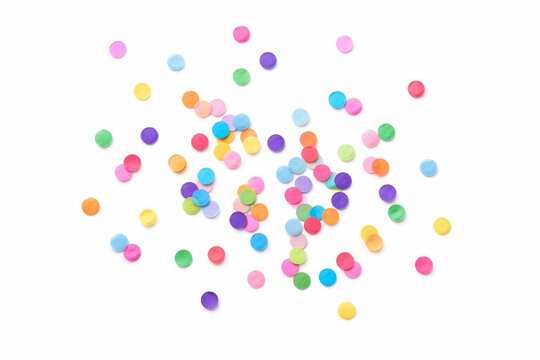 Colorful round confetti scattered on white background