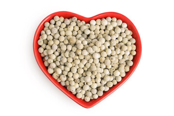 White peppercorns or pepper in ceramic bowl isolated on white background. Top view. Flat lay
