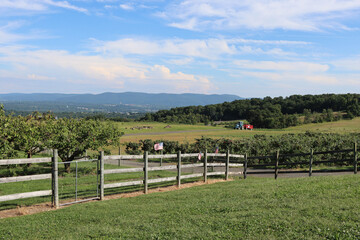 American Farm with Tractor, Fence, and Mountains in Orange County New York