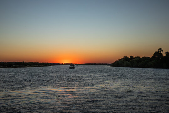 Cruising the Zambezi River, in Zimbabwe, Africa, at sunset