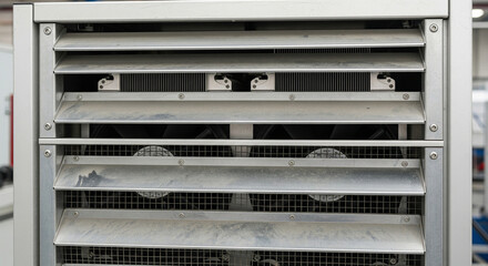 Close-up of air cooling, featuring strategically placed fans and vents that optimize airflow to accelerate cooling during industrial processes in manufacturing.