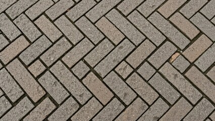 Close-up of interlocking brick pattern arrangement on pavement surface