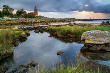 sunset view of the Bornholm coast and the historic Svaneke lighthouse