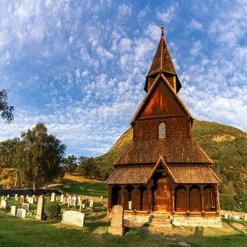 view of the historic wooden 12th-century Urnes Stave Church in golden evening light
