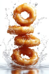 floating calamari rings with tartar sauce splash, isolated on white background