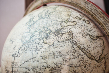 Close-up shot of the northern hemisphere of an antique globe showing Europe and Africa