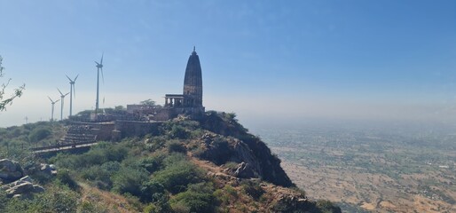 Scenic View of Harsh Parvat Temple and Wind Turbines in Aravalli Range, Rajasthan, India 