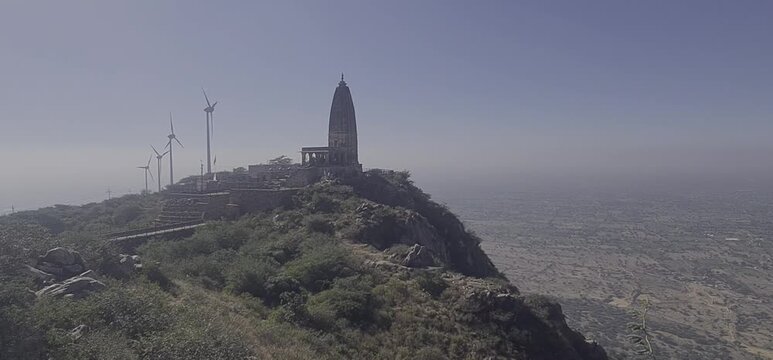 Scenic View of Harsh Parvat Temple and Wind Turbines in Aravalli Range, Rajasthan, India 