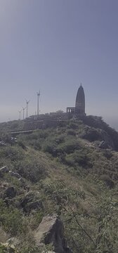 Scenic View of Harsh Parvat Temple and Wind Turbines in Aravalli Range, Rajasthan, India 