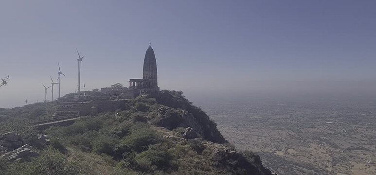 Scenic View of Harsh Parvat Temple and Wind Turbines in Aravalli Range, Rajasthan, India 