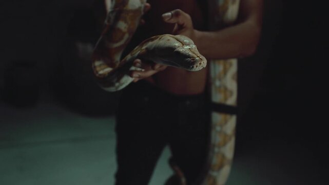 Man holding a python