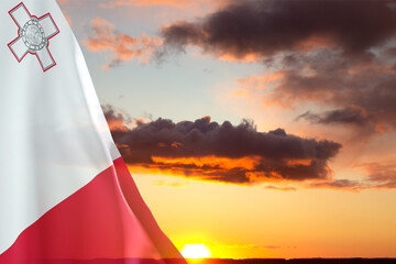 Flag of Malta against the sunset. National Holidays concept © ecrow