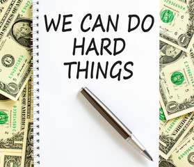 Support, help we can do hard things symbol. Concept words We can do hard things on beautiful white note. Beautiful dollar bills background. Business we can do hard things concept. Copy space.
