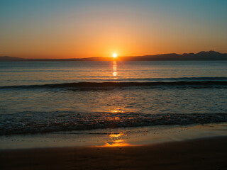 Golden Sunset Over Calm Ocean Waves