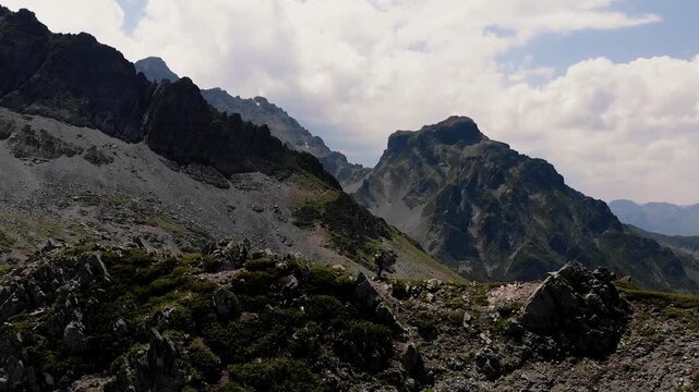 Hiker walking on mountain ridge in Rize Kackar Mountains, Turkey