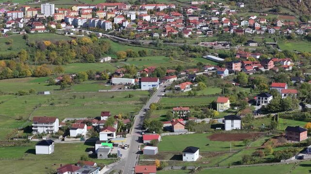 Aerial video of Krum&euml; and surrounding green fields at the foothills of the mountains in northern Albania.