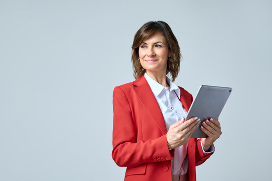 40s mature professional business leader executive woman office worker holding tablet computer isolated. Latin hispanic middle aged businesswoman thinking, dreaming looking away proudly. Copy space