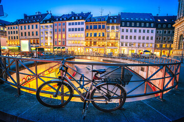 Naklejka premium Germany. Historic Munich cobbled street and colorful architecture evening view
