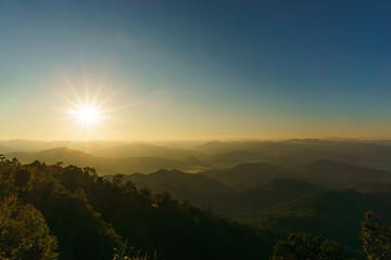 Beautiful winter sunset over the many mountain ranges in Mae Hong Son Province, Thailand.