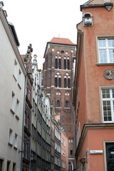 Fototapeta premium street, architecture, city, building, old, europe, house, town, urban, travel, facade, window, tourism, buildings, ancient, medieval, houses, view, narrow, sky, cityscape, belgium, windows, italy