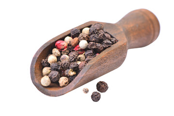 Black pepper in a wooden scoop isolated