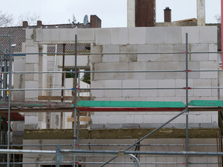 Demolition work on a construction site with concrete pillars, steel beams, etc.