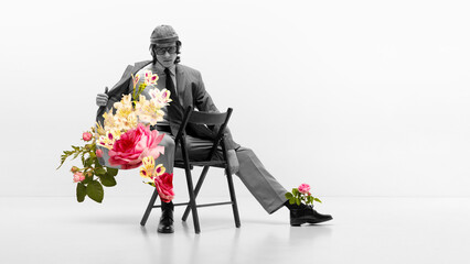 Surreal floral composition with seated man and roses. Concept of conceptual fashion visuals, creative promotion, art publishing, editorial design, and gallery presentation use.