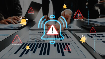 Business team analyzing data with alert symbols indicating security and system warnings during a strategic meeting in a modern office environment Gluon.