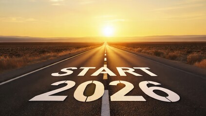 Start 2026 text painted on a long desert highway road leading towards a bright golden sunset, symbolizing new year beginning, future goals, journey, and motivational success.