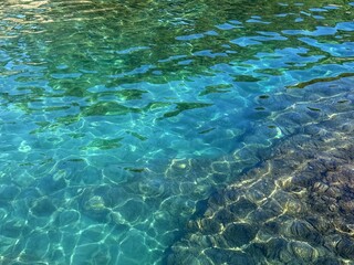 Turquoise Mediterranean sea with underwater algae.