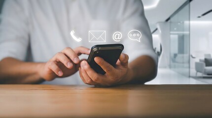 Digital communication concept showing a man using a smartphone with floating contact icons for email, phone, and chat.