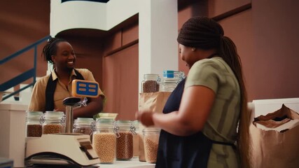 Happy customers enjoy sustainable shopping experience at a local eco-friendly bulk food store, promoting responsible consumption and community support among women