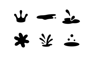 Collection of black ink splatters and drops on a white background