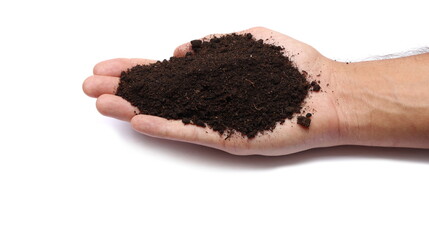 handful of brown soil isolated on white background