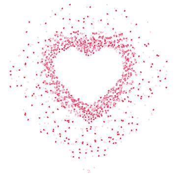 Heart shape made of pink confetti exploding outwards.