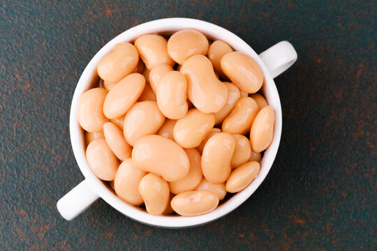 Plain white butter beans in bowl closeup for protein, diet or vegan food concept