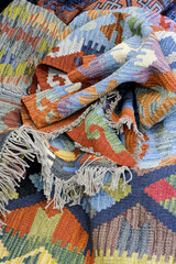 Group of assorted carpets and rugs of various sizes and colors