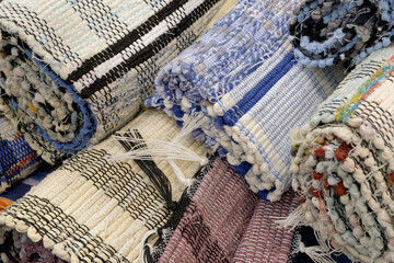 Group of assorted carpets and rugs of various sizes and colors