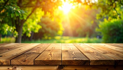 Empty wooden table in a sunny garden with green trees and bright sunlight filtering through the leaves.