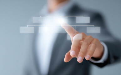 Confident professional business man touching virtual screen diagram showing organization chart on digital interface with focused finger and connection